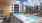 Patio with soft seating and view of the pool.