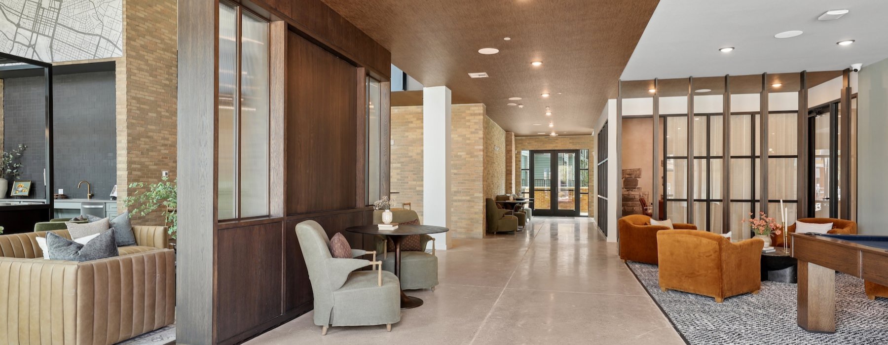 a lobby with chairs and tables