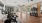 Cardio room with equipment and garage door to outdoor workout lawn