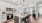 A Kitchen With Stainless Steel Appliances, sink, and barstools
